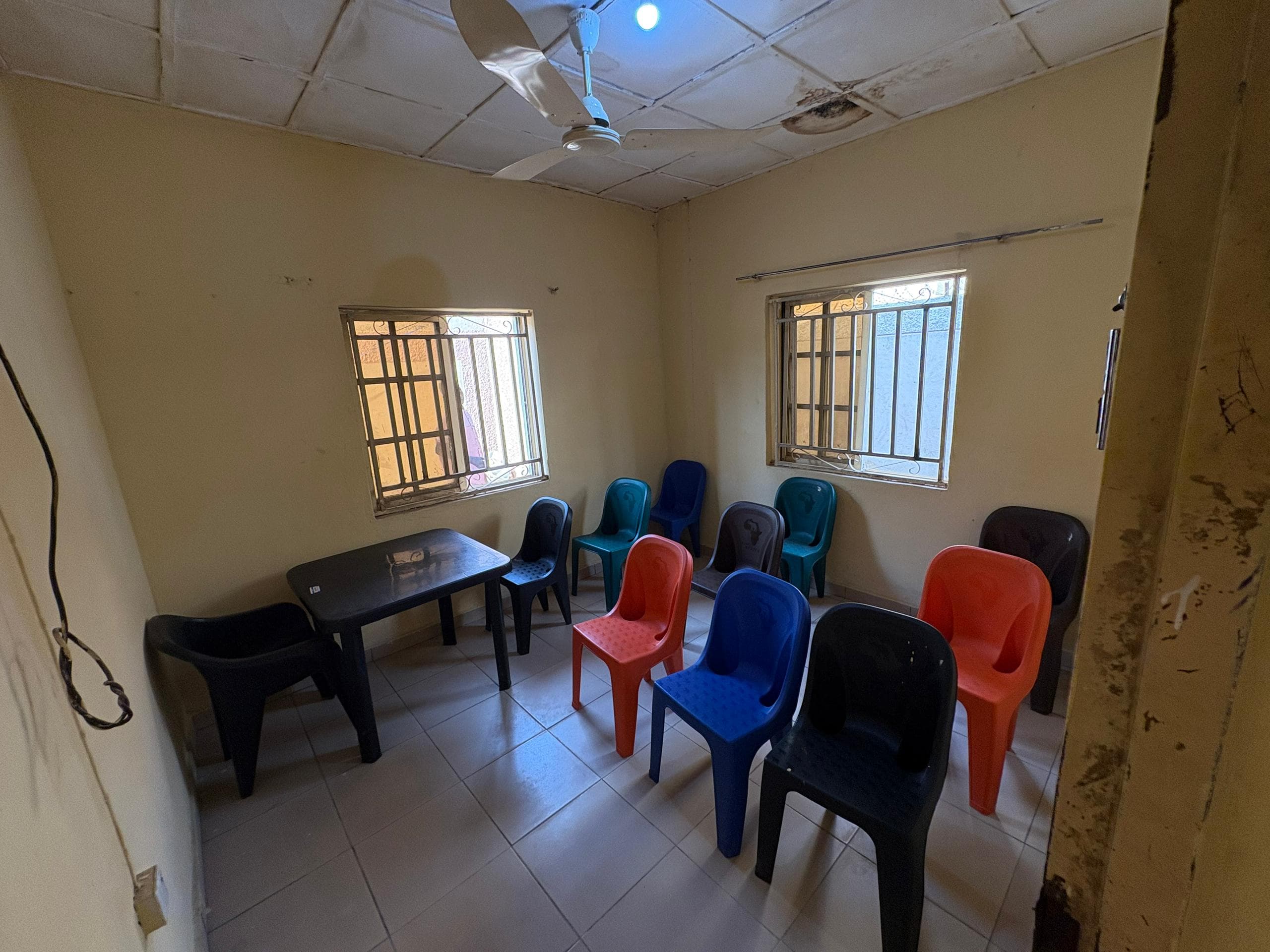 A community room set up with chairs for a gathering